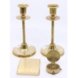 Brassware to include: a pair of Candlesticks, a compass and square shaped compact (4)