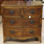 An early Victorian mahogany bow fronted chest of drawers, fitted with two short over two long