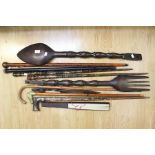 A collection of walking sticks, plus other treen items