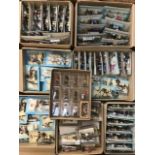 Atlas/Starlux model figures and soldiers, mostly unopened, along with wooden display stands. (2
