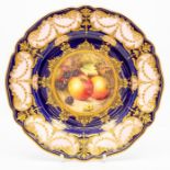 A Royal Worcester dessert plate by Richard Sebright, dated 1924, of lobed circular shape and