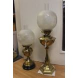 Two early 20th Century oil lamps, brass with etched shades