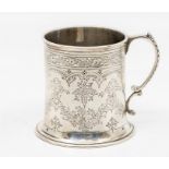 A Victorian silver mug, on spreading circular foot, C-scroll handle, the body profusely engraved