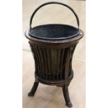A 20th century mahogany wine cooler on three claw feet, with inner brass bucket, height approx.