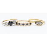 An 18ct gold and diamond set ring, size O, 2.5gms; two 9ct gold rings set with sapphires and white