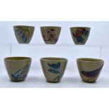 Moorcroft Pottery: A group of 6 Moorcroft eggcups with flowers, bird, butterfly and fish