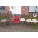 A set of three Victorian walnut balloon back chairs, having carved backs, raised on French