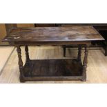 A traditional joined oak buffet table, incorporating 17th Century elements, the plank top raised