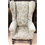 A Victorian 'Carolean' style wing chair, pegged mortise and tenon construction, upholstered in
