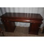 An early Victorian mahogany twin sideboard, fitted with three frieze drawers, raised over two