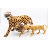 A Beswick lion and lioness, along with an Italian leopard