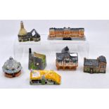 A collection of seven castle cottages, hand made and hand painted
