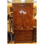 An early 19th Century mahogany Secretaire bookcase, circa 1830, the upper section with Gothic