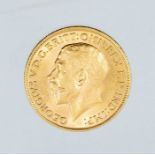 A 1915 George V gold sovereign, London mint.