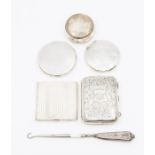 A group of silver to include: a cigarette case; three various powder compact cases; a circular
