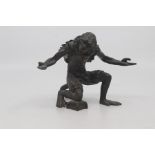 A Continental bronze figure of a monkey jester, possibly Austrian, late 19th Century, modelled in
