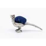 A silver pin cushion in the form of a pheasant, length approx 45mm, height approx 20mm, stamped 925,