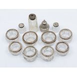 Four pairs of early 20th Century hobnail and cut glass circular salts with silver collars, various