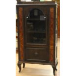 An early to mid 20th century display cabinet, fitted with a single glazed door to upper section
