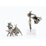 An abstract silver miniature model of a Matador on perspex stand and a Mexican silver brooch cast as