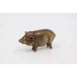 A vintage novelty brass match holder cast as a Pig