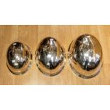 A set of three silver plated graduating meat / food dish covers by Walker & Hall of Sheffield silver
