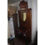 A late Victorian mirror backed hall stand, 230cm high, 99cm wide, 42cm deep