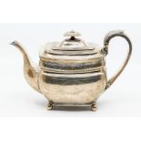 A George III Provincial large silver teapot oblong shaped with bright cut engraved decoration, the