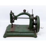 A small early 20th Century table top sewing machine, cast iron, possibly German