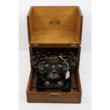 An automatic bank punch hole machine, late 19th Century, fitted in the original oak box, made by the