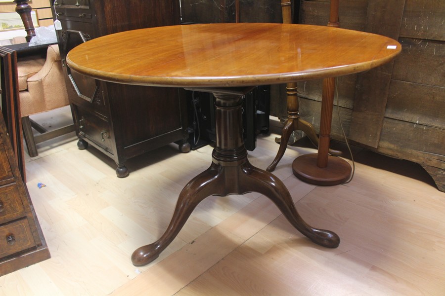 A 19th Century and later tilt top tripod table, fitted with an oval top, raised on a two part turned - Image 2 of 3