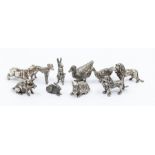 A collection of 925 stamped silver model of miniature animals to include: lions, hippo, hare,