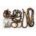 A collection of jewellery to include tigers eye bead necklaces along with two bracelets and a tigers