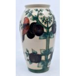 Moorcroft Pottery: A Moorcroft 'Plum Tree and Bird' pattern vase designed by Sally Tuffin. Height