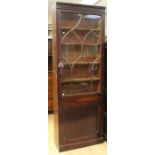 A George III mahogany bookcase centre, circa 1770, in the Gothick Revival style, fitted with a