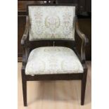 An early 19th Century mahogany open armchair, cream upholstered back and drop in seat, 88cm high ***