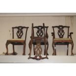 A set of six Chippendale style chairs, 20th Century, comprising two carved chairs and four side
