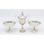 A matched pair of silver bon bon dishes raised on central trumpet feet, by M M Henderson Ltd,