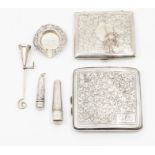 A collection of silver smoking paraphenalia to include: two profusely engraved cigarette boxes,