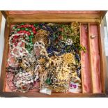 An oak box containing a collection of costume jewellery including tigers eye, yellow and white metal