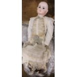 A 20th century REPRODUCTION Jumeau porcelain headed doll, numbered 13. Fixed eyes and closed