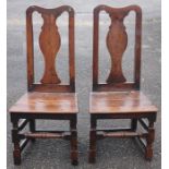 A pair of early 18th Century joined back stools, solid seats, turned supports, each 103cm high, 47cm