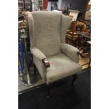 A modern high back armchair, grey upholstery, height approx. 120cm.