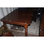 A Victorian mahogany extending dining table, raised on turned legs, measuring 76cm high, 212cm long,