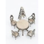 A group of miniature silver furniture to include: Four Russian .84 standard (1st Kokoshnik mark)