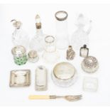 A collection of silver topped glass, vanity bottles, powder pots, condiment glass bottles, pin