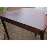 A pair of George III mahogany demilune tables, circa 1800, forming one circular table when fixed