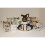 A collection of 19th Century early to late Staffordshire pottery jugs including frog, mugs and other
