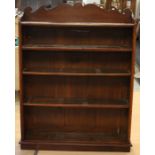 An early 20th Century pine open bookcase, fitted with four shelves and a base section, the top