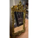 Three modern mirrors - one large gilt framed and ornately carved, one rectangular gilt framed and